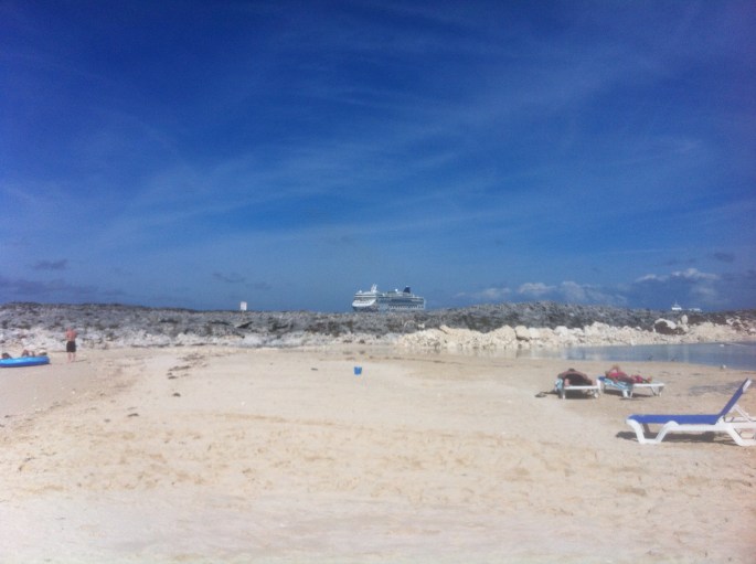 NCL Pearl anchored off in the distance from Great Stirrup Cay, Bahamas.