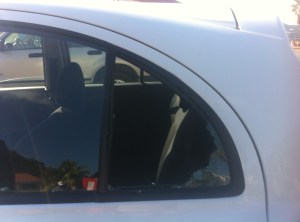 Toyota March window broken by thieves in St. Martin.
