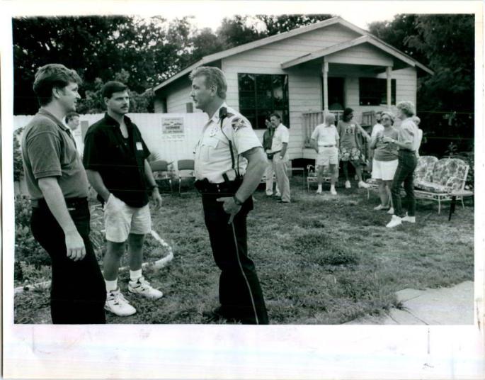 The first new-construction home in the downtown area for many years was built just north of the Round Lake area in what is now broadly known as Uptown.  This picture was taken for the St. Petersburg Times showing National Night Out Against Crime where the two community police officers from the Uptown neighborhoods attended along with others in the neighborhood to celebrate the new home being built at 1022 Eighth Street North.