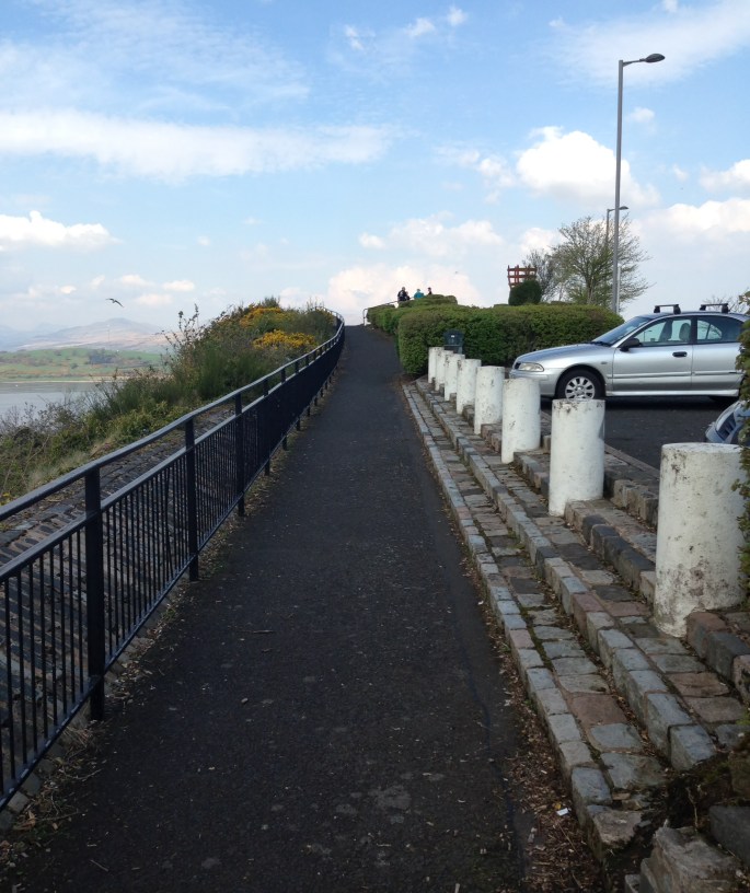 There is a place to park cars and some paved foot paths along the scenic section.