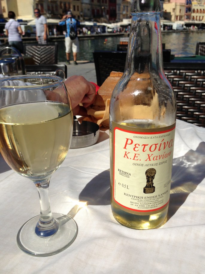 Nothing says Greece like a bottle of Retsina, a sidewalk cafe and a view of an incredible little charming harbour town.  Chania, Crete, Greece.