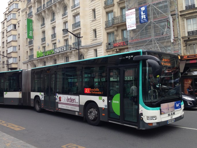 You can certainly take public transport from the Gare du Nord to the Gare de Lyon.  For us, the relatively cheap taxi fare and the schlepp factor made it worth doing a cab.