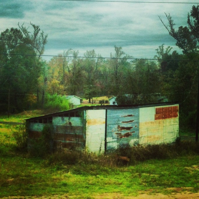 Buildings along the roadside along US 190 are often dilapidated or abandoned.