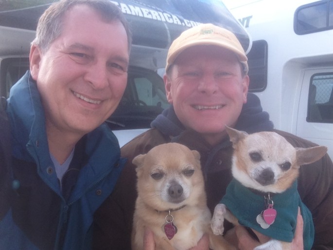 Here we are with our two chihuahuas picking up the RV in the background in Chicago ready to start discovering the country in our RV.