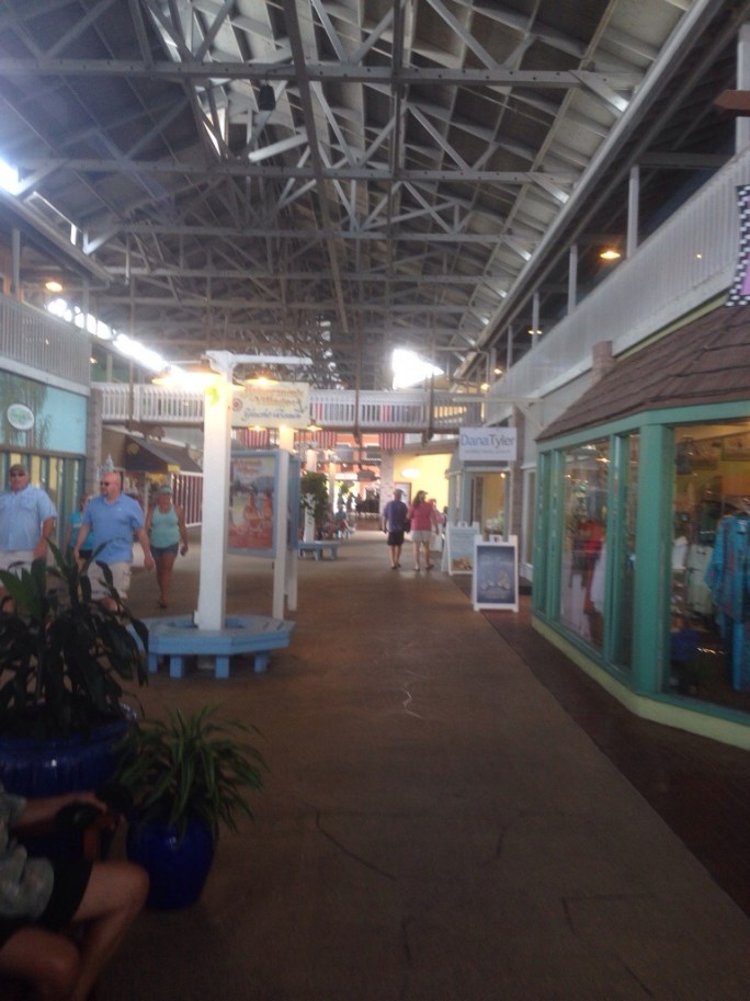 The covered walkway along modern shops at Fisherman's Village in Punta Gorda, Florida.