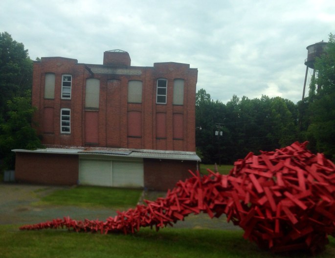 One of the pleasures of travelling the back roads is that the most random stuff pops up like this art and abandoned building together.